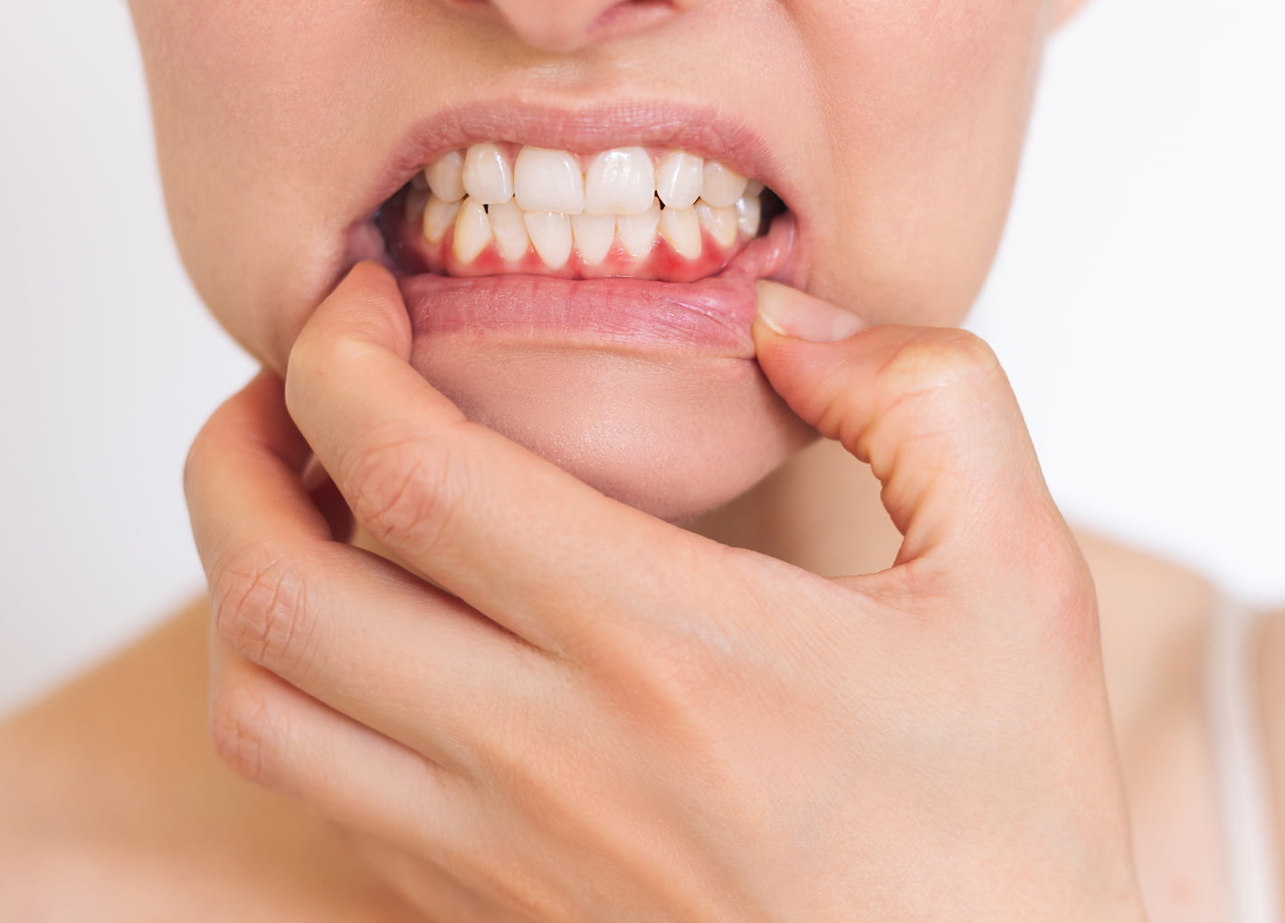 Dentist examining a patient's gums for periodontal disease