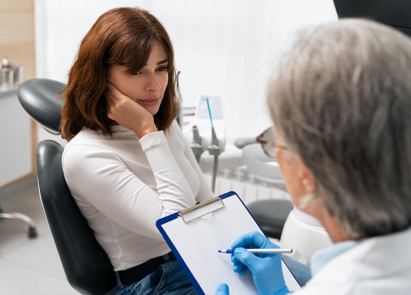 Patient receiving treatment for TMJ/TMD at the dentist