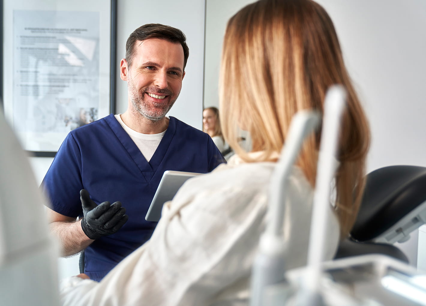 Dentist reviewing a personalized treatment plan with a patient