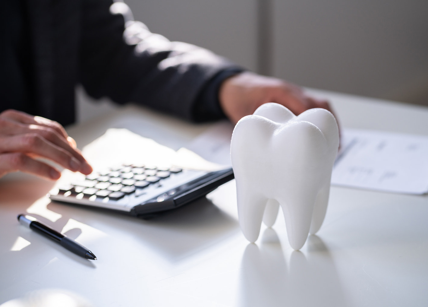 Patient reviewing flexible financing options with a dental staff member